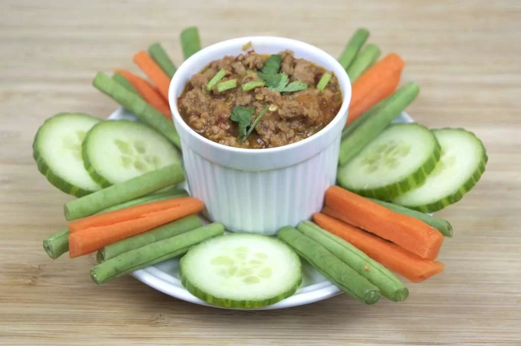 Discover the best Nam Prik Ong in Pattaya! Explore the recipe, ingredients, restaurants, and variations of this spicy pork and tomato dip dish.